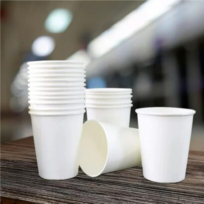 Stack of premium white single wall paper cups for water and lassi