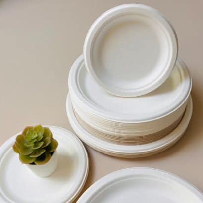 Stack of premium white eco-friendly biodegradable plates in various sizes