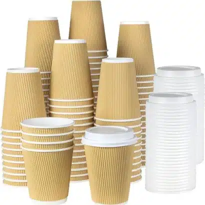 Stack of premium kraft brown corrugated ripple wall paper coffee cups with white sipper lids