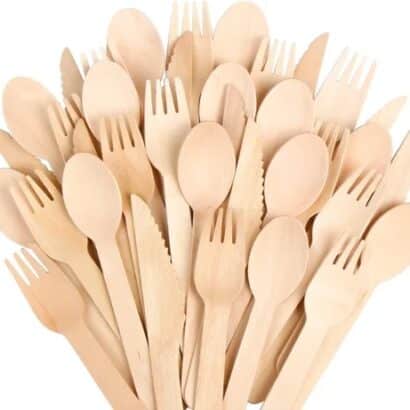 Assorted eco-friendly disposable wooden cutlery including spoons forks and knives